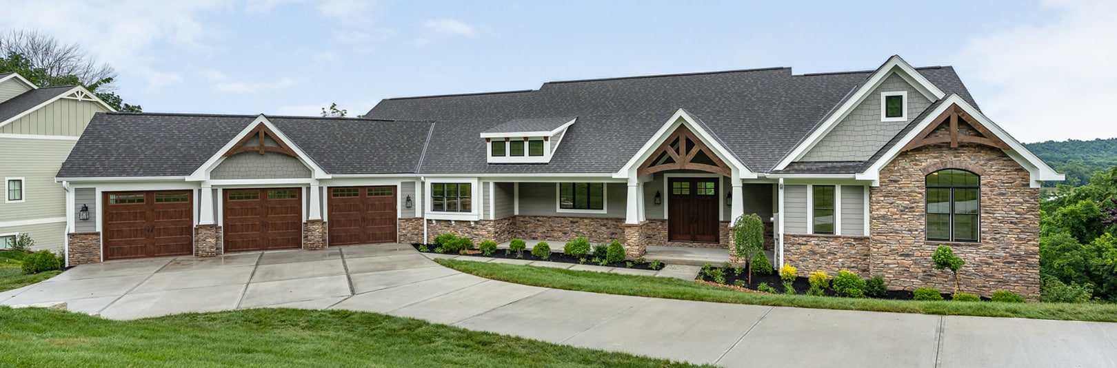 Exterior of home at The Reserve at Rivers Pointe with landscaping and driveway (cropped)