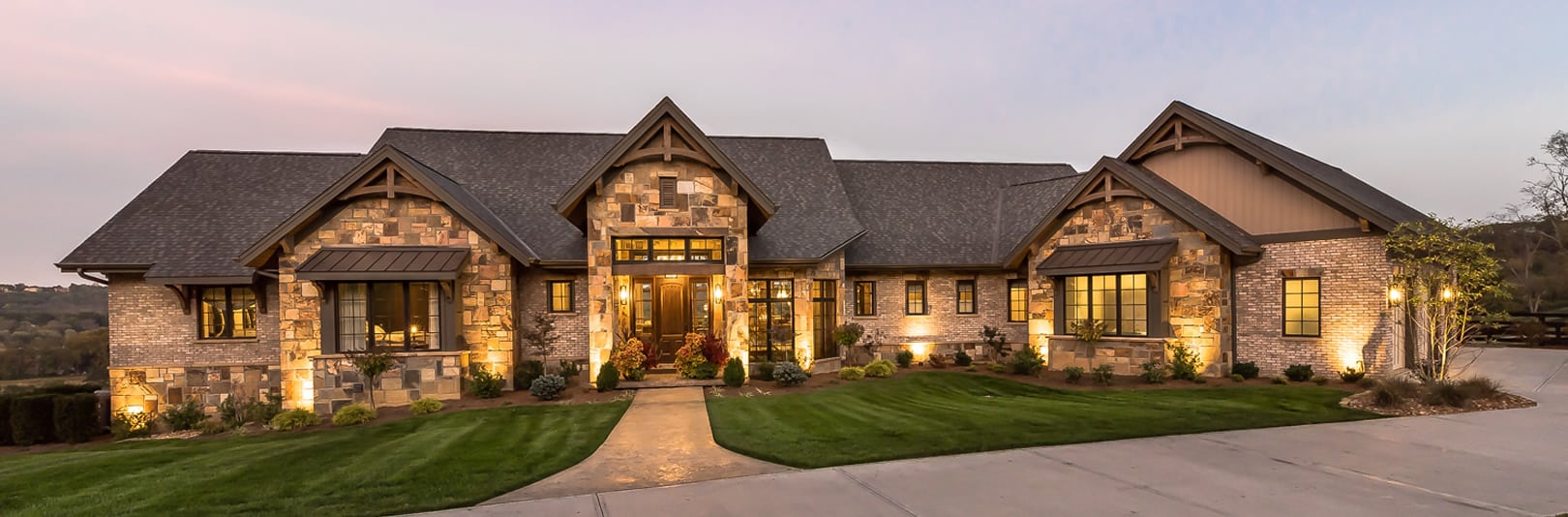 Lighted exterior of home at The Reserve at Rivers Pointe (cropped)