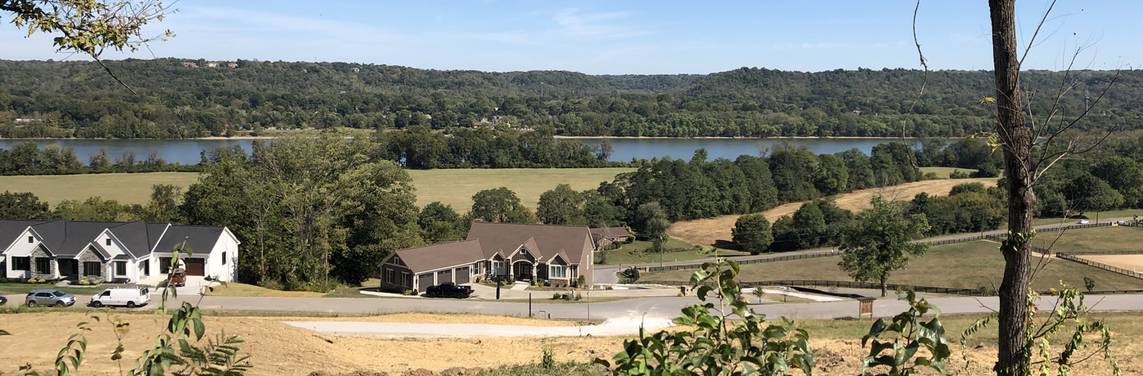 Homes and homesites at The Reserve at Rivers Pointe with river in background (cropped)